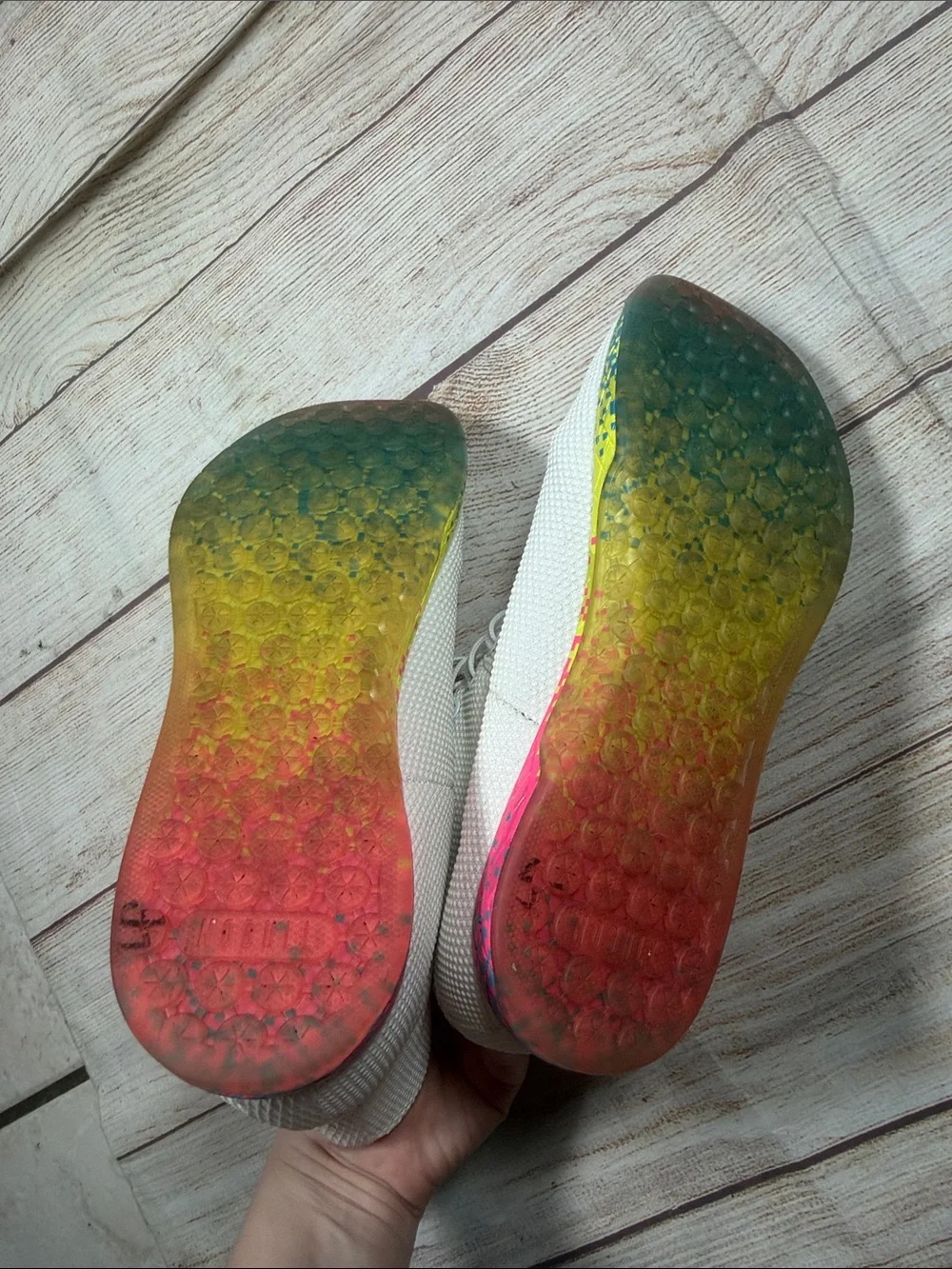 NOBULL‎ white high-top trainers featuring a vibrant multi-color glitch sole